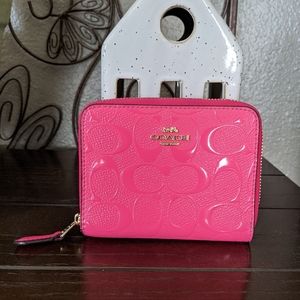 Coach Embossed Pink Zip Around Wallet